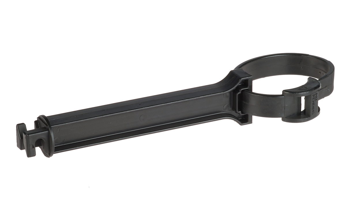 A black plastic clamping strip clip featuring a circular loop and a long rectangular body for industrial fastening applications.