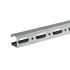 Close-up of a galvanized steel mounting rail with oval-shaped slots and square holes on a plain white background.