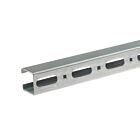 Close-up of a galvanized steel mounting rail with oval-shaped slots and square holes on a plain white background.
