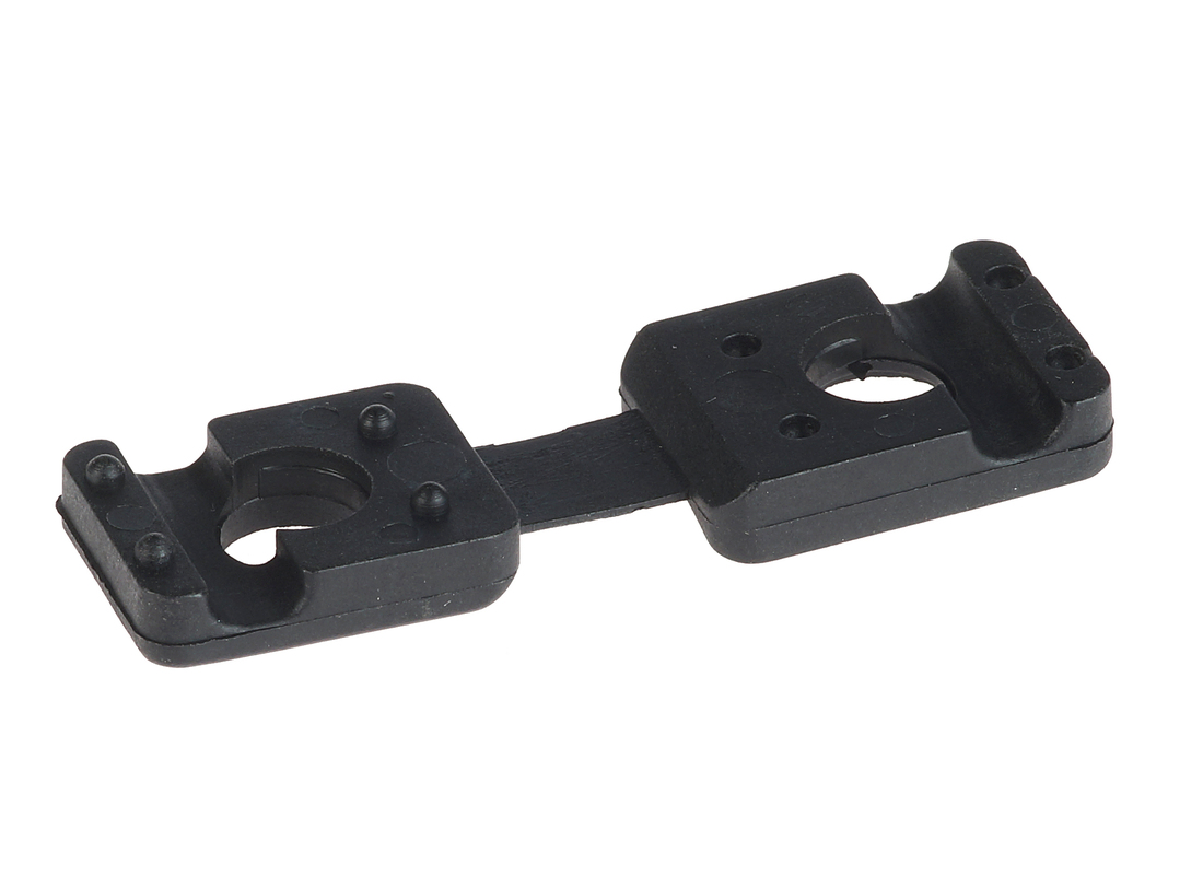 A black plastic clamping pin with two rectangular sections and central holes, designed for industrial mounting on a white background.