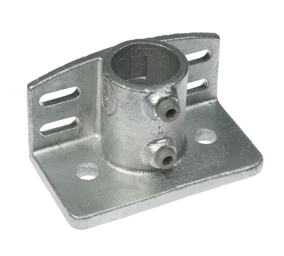 A galvanized cast iron base plate featuring a 1.5-inch pipe sleeve and integrated kick edge for secure floor mounting.