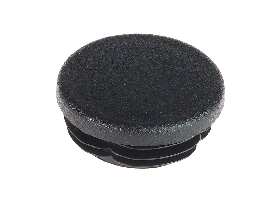 A close-up of a black round plastic end cap with a textured surface and ribbed base for secure pipe installation.